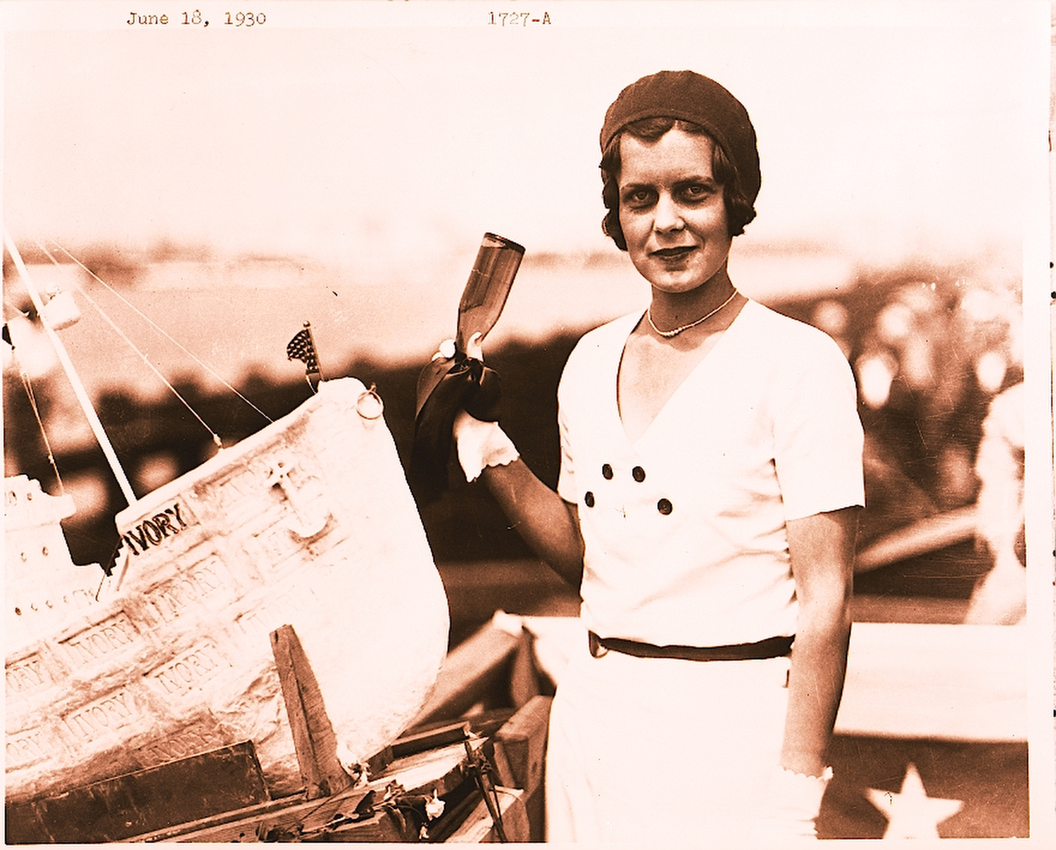 Harriet Hauge, daughter of Long Beach Mayor Oscar Hauge, prepares to christen one of the more unusual vessels to be launched at the port. The 4-foot-long boat made of Ivory Soap commemorated the 1930 opening of the Procter & Gamble plant