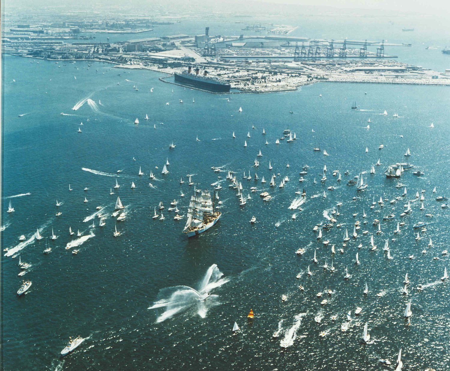 The tall ship Eagle is greeted by a flotilla of pleasure craft and other vessels during bicentennial celebrations in 1976.