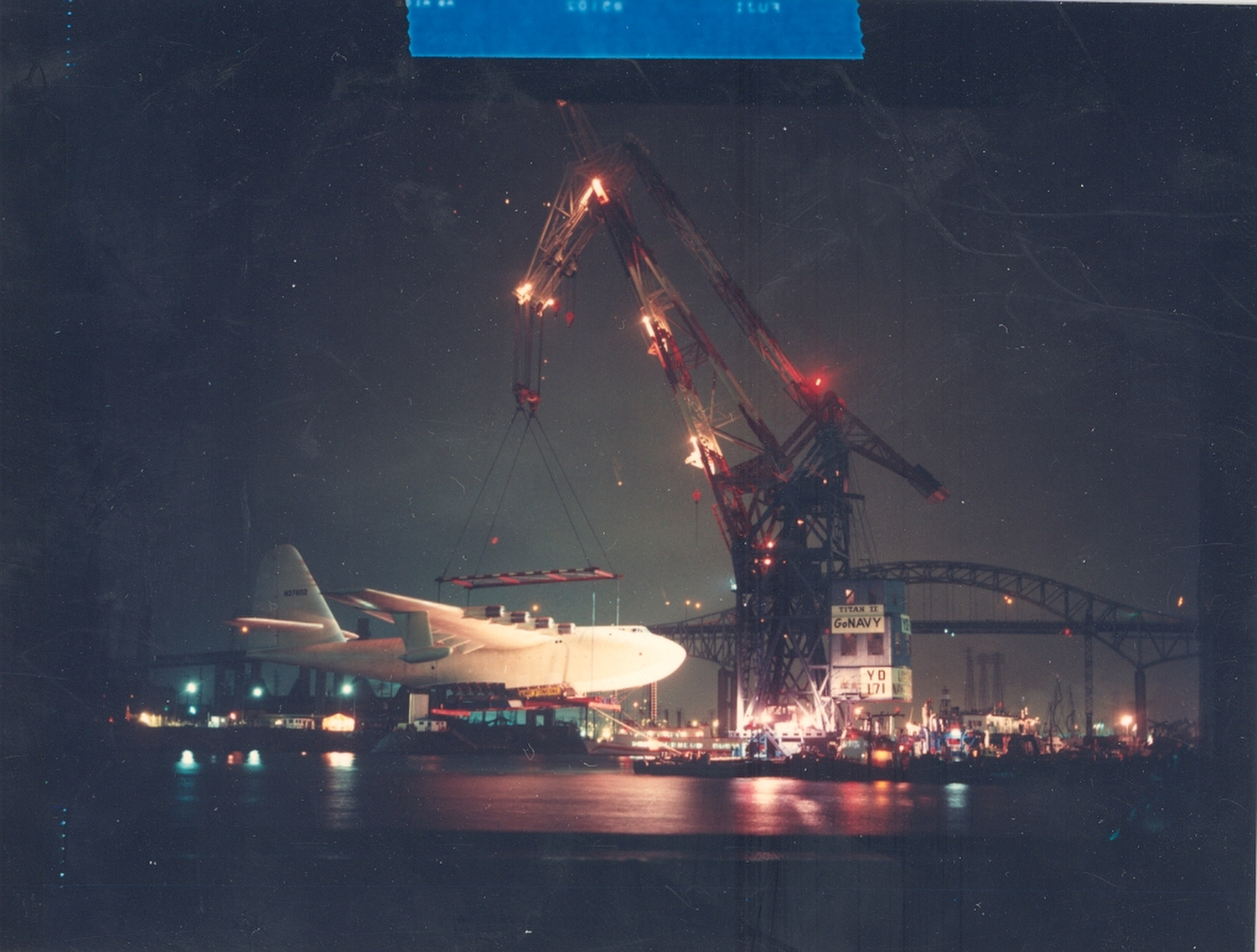 Floating crane Herman the German lifts the Spruce Goose as part of its move into its dome next to the Queen Mary in 1982.