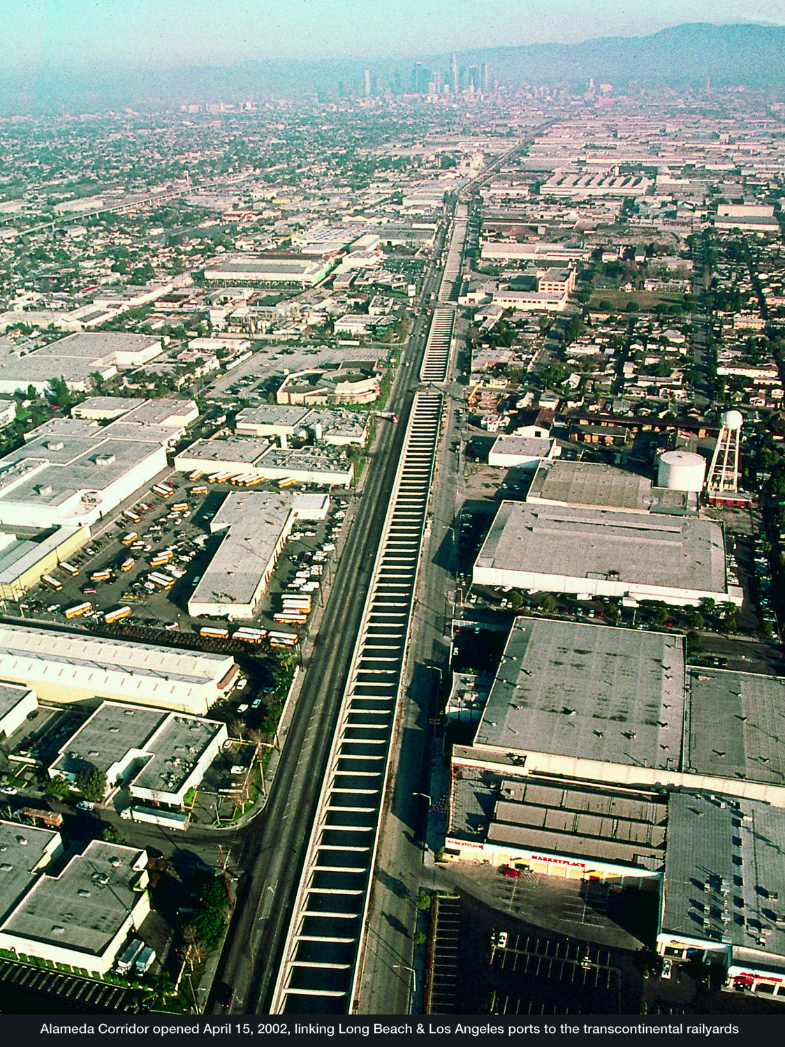 The Alameda Corridor opens in 2002, allowing freight trains to travel from the ports to transcontinental rail yards near downtown Los Angeles quickly, without disrupting road traffic.